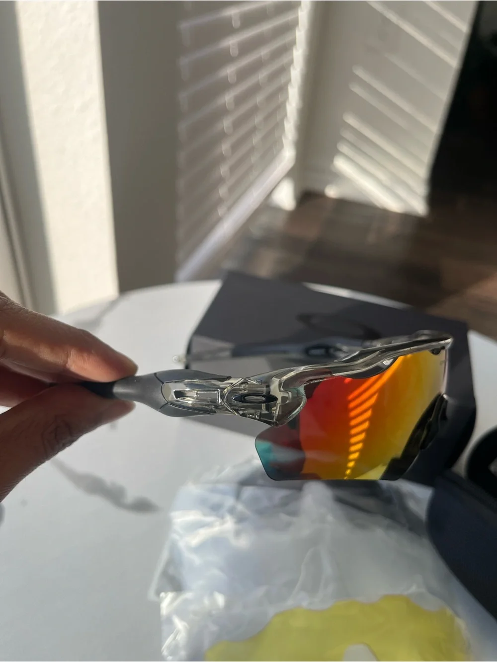 Oakley Clear Frame Sport Sunglasses with Red-Orange Mirror Lenses